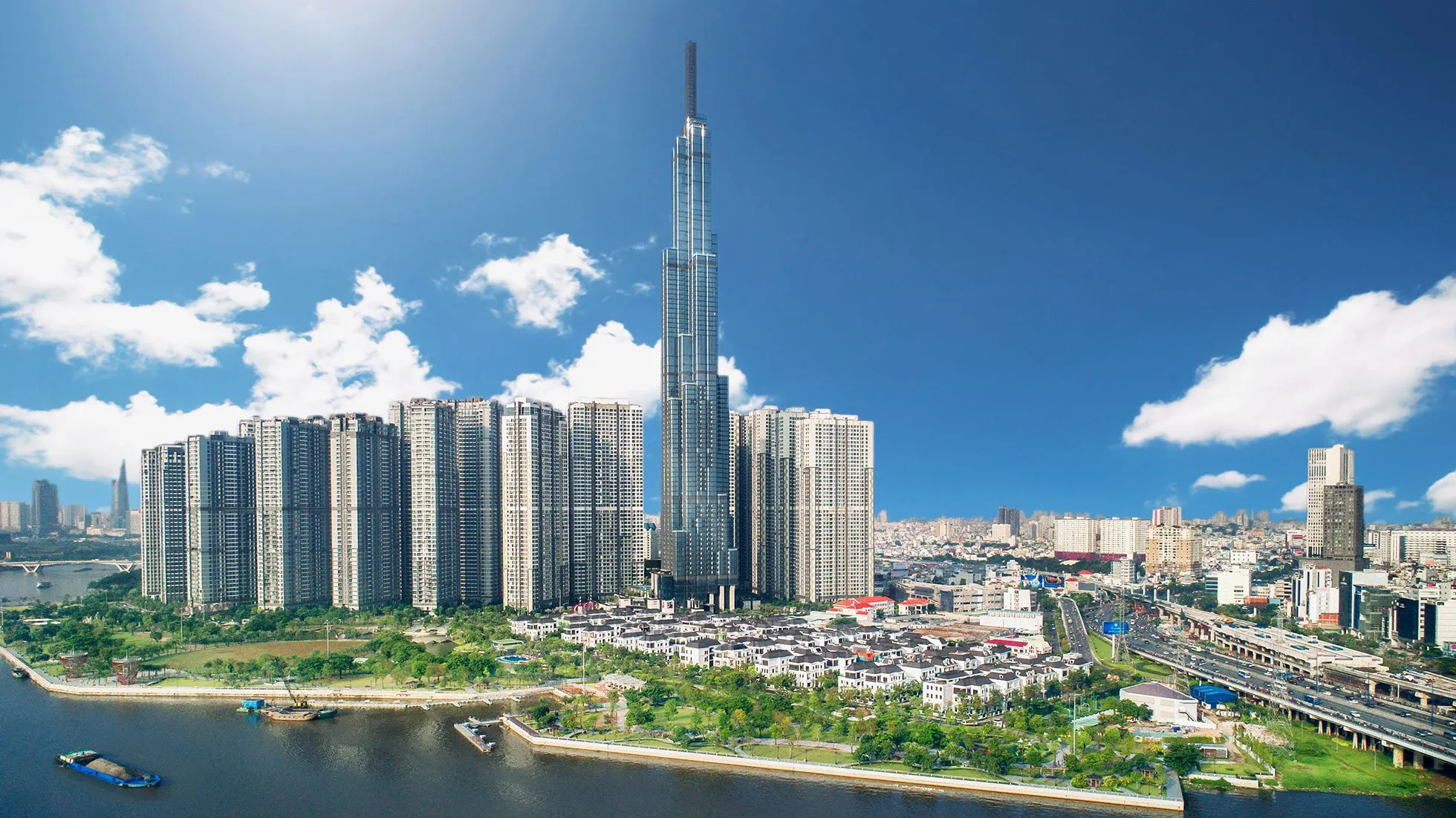 Cảnh quan đô thị ven sông tại TP.HCM với tòa tháp cao tầng, gần khu vực Bình Chánh nơi có Vinhomes Hưng Long Bình Chánh