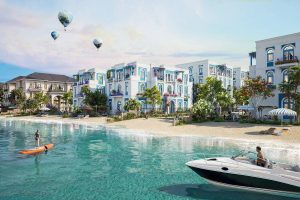 Phối cảnh khu thấp tầng ven biển trong dự án Vinhomes với bãi cát, du thuyền và khinh khí cầu