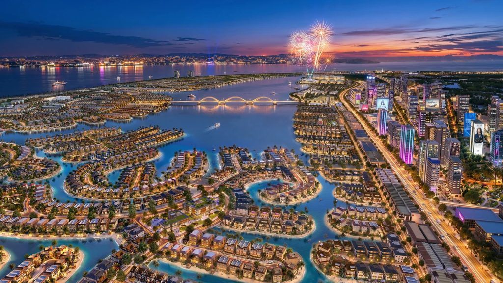 Phối cảnh khu đô thị ven biển về đêm với hệ thống kênh đảo, biệt thự và pháo hoa tại dự án Vinhomes